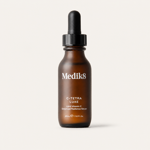 Medik8 C-Tetra Luxe on a warm cream background