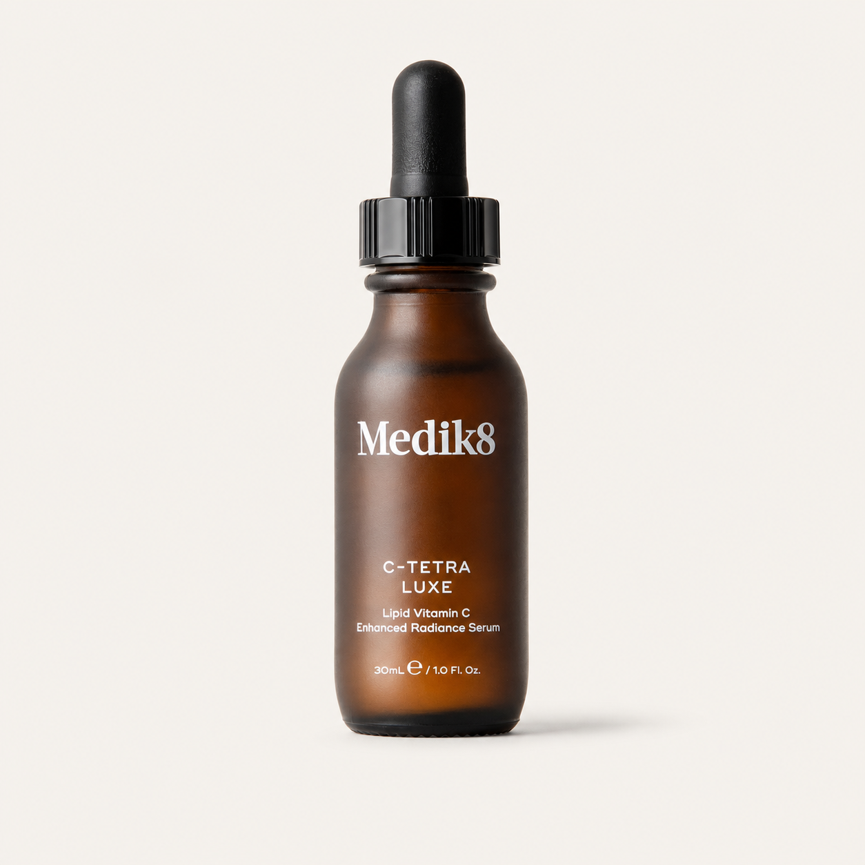 Medik8 C-Tetra Luxe on a warm cream background