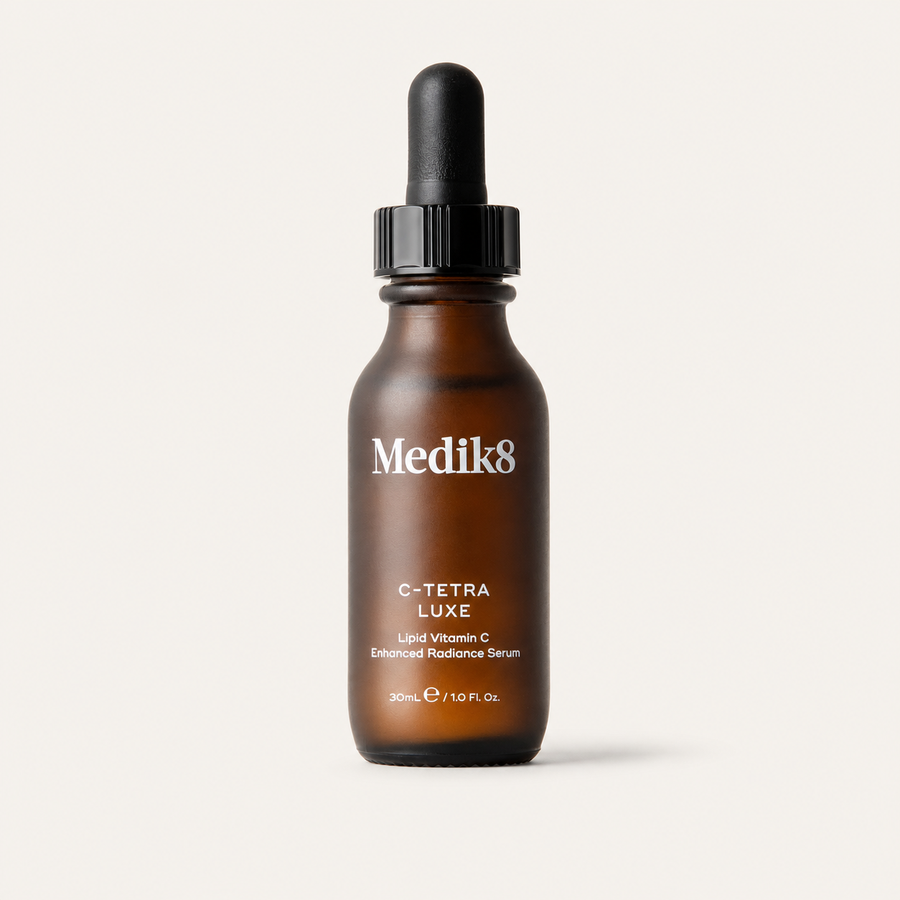 Medik8 C-Tetra Luxe on a warm cream background
