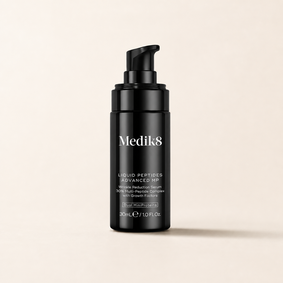 Medik8 Liquid Peptides Advanced MP on a warm cream background
